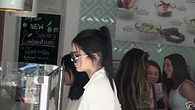 Smoking hot celebrity walks around in a flimsy shirt and tight pants