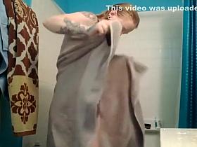 Naked stepmother spied in bathroom