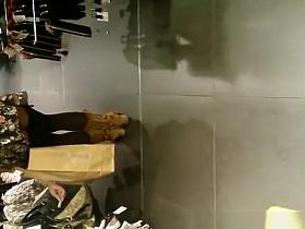 Exhibitionist woman lifts dress in store