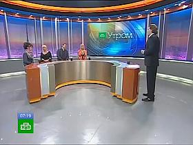 Big-breasted bimbo with hot cleavage on Russian TV