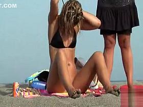 Skinny naked girl puts on her bikini