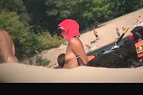 Busty topless in nudist beach