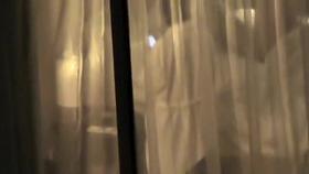 Female in bath robe was voyeured thru the window