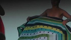 Hot babe sunbathing on the beach