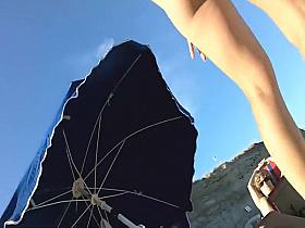 Spying a bent over beach babe