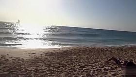 Topless girl on the beach has a nice booty