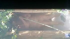 Mature woman spied during a shower