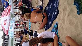 Blonde black thong on beach