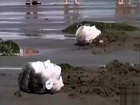 Naked performance art on the beach