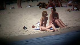 Buxom blonde filmed on a nudist beach