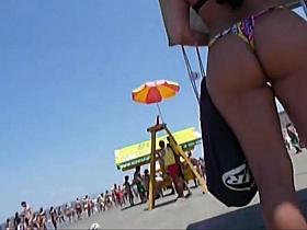 Delicious butt in thong on the beach !
