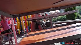 Sexy sitting upskirt in a street cafe