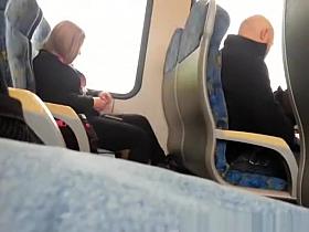 Guy plays with his cock next to female passenger