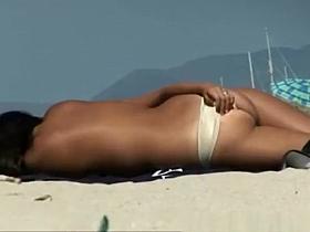 Busty lesbians topless in the beach