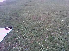 Girl in tiniest bikini getting sun tanned in the field PICT0011