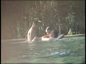 Three hot people having sex in the water