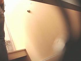 Changing room spy cam action with girl in jeans topless