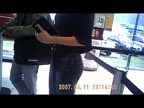 Pretty girl waiting at gas station.