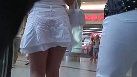 Blonde stunner surrenders an upskirt view on the stairs