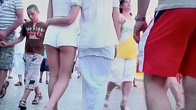 Two lesbian babes are walking around in white shorts