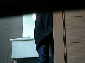 Cute babe filmed pissing by a toilet voyeur