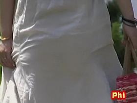 Teeny oriental hottie loses her long skirt when some dude rips it