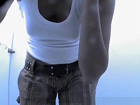 Woman changing bikini bottom for thong