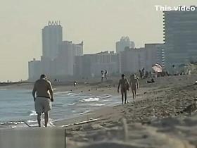 Peeping at a hot nudist couple on the beach