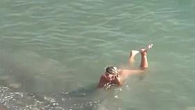 Nudist girls expose bodies at the beach