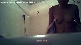 Asian woman spied showering in bathtub
