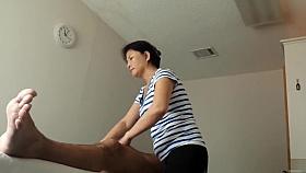 Mature Asian masseuse strokes him to an orgasm