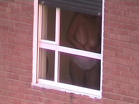 Guy made a window peep vid with a fat bimbo