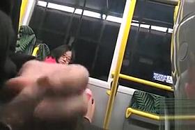 Dude beats off on a lovely Asian lady in the train