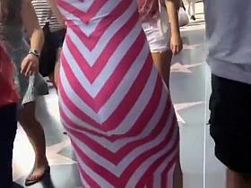 Big ass woman in tight white and pink dress