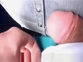 Guy rubs cock in pants in concert