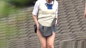 Oriental teenagers urinating in street