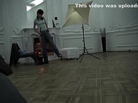 Nude model posing for photographer