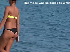 Bubbly butt cheeks falling out of bikini