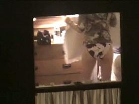 A crafty voyeur window shot of a girl in cow panties