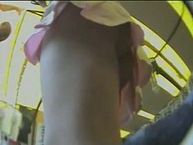 Delicious bimbo in short, pink skirt gives us hot up skirt view