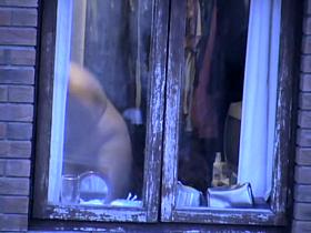 Natural look of the naked fatty amateur thru window