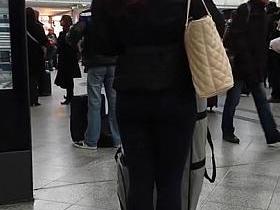 Candid street, shiny jacket and blue leggings