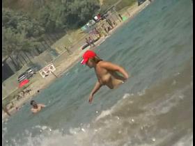 Nice babes are being filmed on camera on the beach