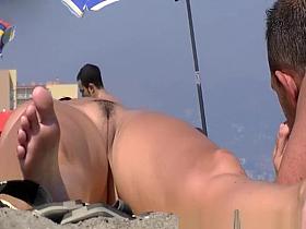 Beach voyeur secretly films trimmed pussy