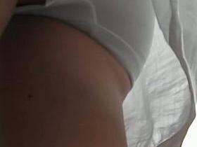 Street spy cam video of an up skirt view of white pantyhose