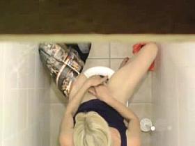 Girl masturbates on the toilet