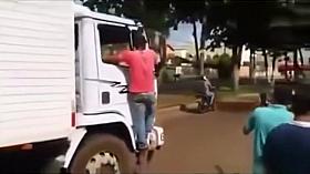 Naked curvy woman on the front of a big truck