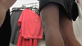 Cutie with hot legs in the fitting room of trade center