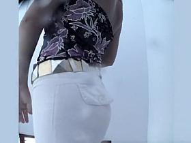 Woman spied in beach cabin dressing