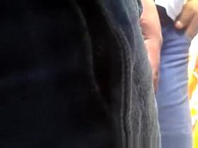 Guy touches women's asses in jeans pants